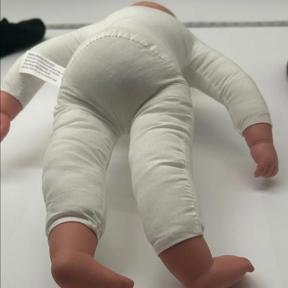 Realistic Baby Doll with White Outfit